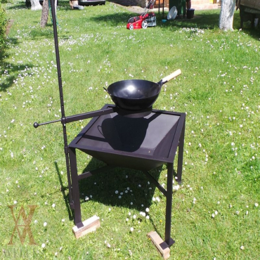 Garden fireplace with the holder for wok frying pan and a copper.